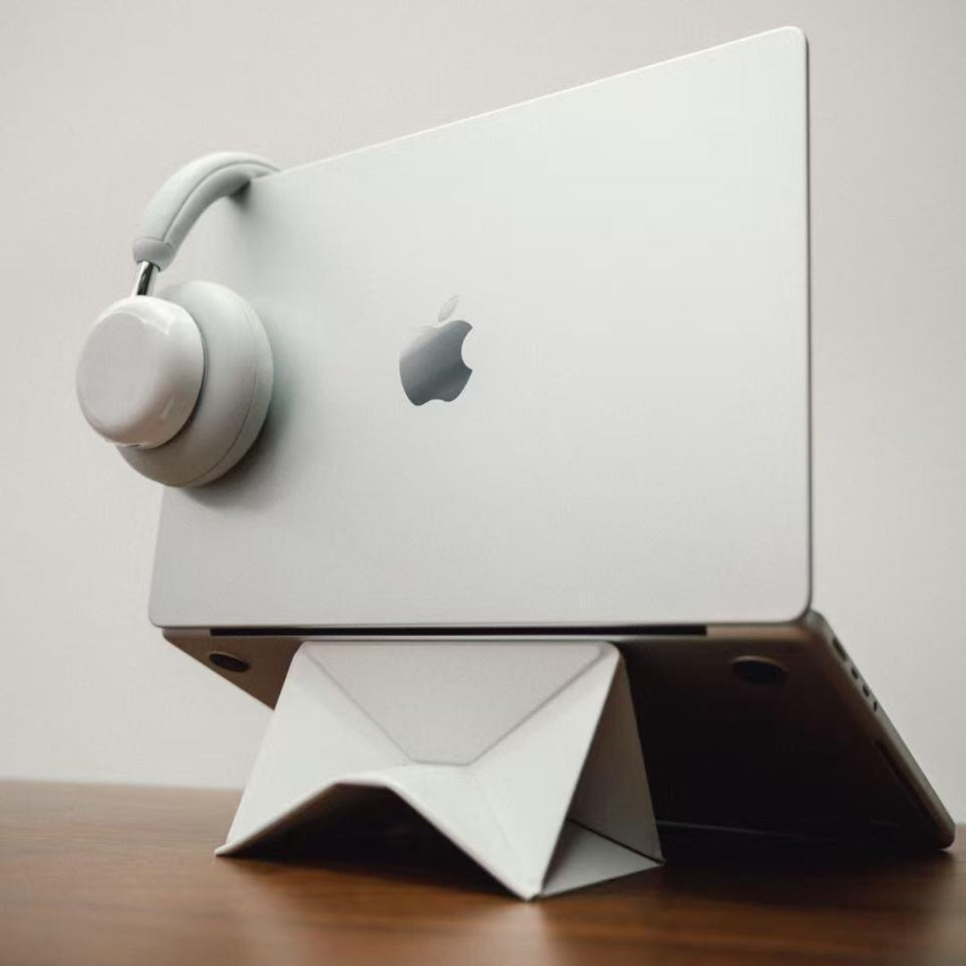 White dual-mode stand with laptop and headphones
